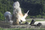In this photo provided by South Korea Defense Ministry, a U.S. MGM-140 Army Tactical Missile is fired during the combined military exercise between the U.S. and South Korea against North Korea at an undisclosed location in South Korea, Wednesday, July 5, 2017. North Korean leader Kim Jong Un vowed Wednesday his nation will "demonstrate its mettle to the U.S." and never put its weapons programs up for negotiations, a day after test-launching its first intercontinental ballistic missile. (South Korea Defense Ministry via AP)
