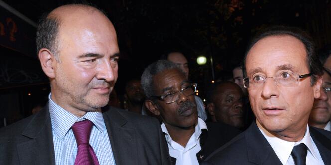 Pierre Moscovici et François Hollande, le 28 septembre, à Paris.