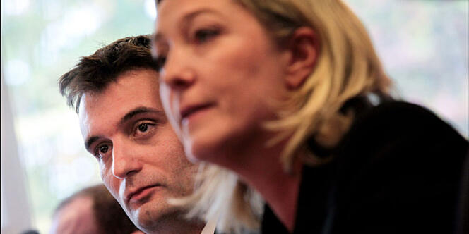 En arrière-plan : Florian Philippot, lors d'une conférence de presse de Marine Le Pen, à Nanterre, le 6 octobre 2011.