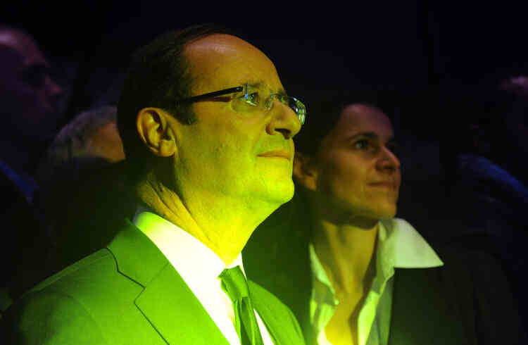 French Socialist Party (PS) candidate for French 2012 presidential election Francois Hollande (foreground) attends a rehearsal of French band Zebda next to his advisor for Culture Aurelie Filippetti as he visits the 36th edition of the "Printemps de Bourges" rock and pop festival as part of his campaign, on April, 27, 2012, in the French central city of Bourges. AFP PHOTO ALAIN JOCARD