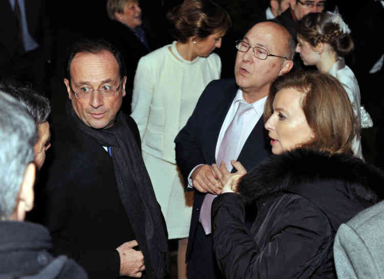 France's opposition Socialist Party (PS) candidate for the 2012 French presidential election Francois Hollande (L), accompanied by his companion Valerie Trierweiler (R) talk with people, on December 17, 2011, in Argenton-sur-Creuse, after  the wedding of his friend Michel Sapin (C), in charge of Hollande's presidential program and MP, with journalist Valerie de Senneville (C, second ground). Hollande was Sapin's best man.  AFP PHOTO/ALAIN JOCARD
