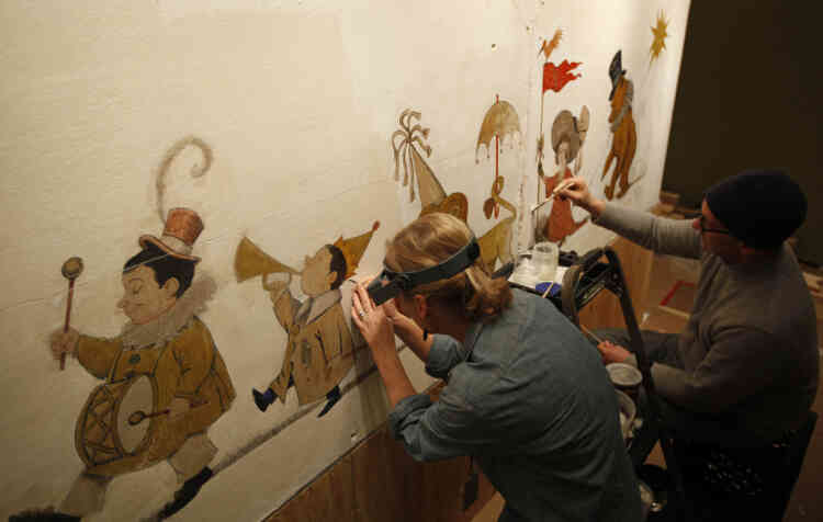 In this Jan. 31, 2011 photo, mural paintings conservator Cassie Myers and conservation technician Lee Dunsmore with Milner + Carr Conservation LLC perform a conservation treatment on Maurice Sendak's 1961 The Chertoff Mural at the  Rosenbach Museum & Library in Philadelphia. (AP Photo/Matt Rourke)