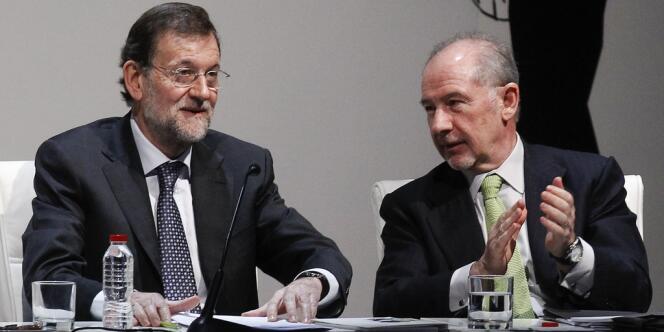 Mariano Rajoy, le président du gouvernement espagnol, et Rodrigo Rato, ancien président de Bankia, en mars dernier. La banque a été nationalisée et devrait être auditée par Goldman Sachs.