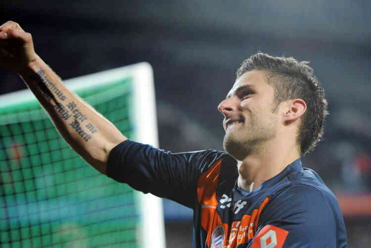 Montpellier's French forward Olivier Giroud reacts after scoring a goal  during the French L1 football match Montpellier vs. Caen on March 11, 2012 at the Stade de la Mosson in Montpellier, southern France.  AFP PHOTO / ANNE-CHRISTINE POUJOULAT