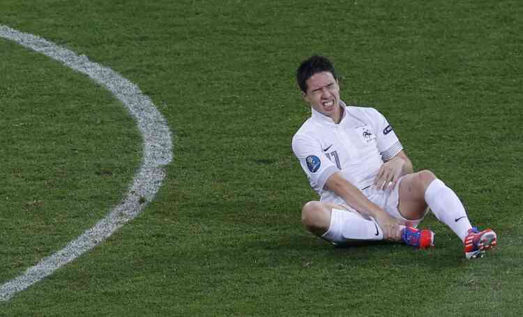 France's Samir Nasri grimasses after being fouled during their Group D Euro 2012 soccer match against Sweden at the Olympic stadium in Kiev, June 19, 2012. REUTERS/Darren Staples (UKRAINE  - Tags: SPORT SOCCER)