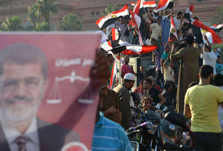 Egyptians celebrate at Cairo’s Tahrir Square the victory of Mohamed Morsi in the presidential elections on June 24, 2012. Muslim Brotherhood member Mohamed Morsi was declared the first president of Egypt since a popular uprising ousted Hosni Mubarak, capping a tumultuous and divisive military-led transition. AFP PHOTO / KHALED DESOUKI