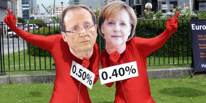 Des manifestants déguisés en François Hollande et Angela Merkel à Bruxelles, où s'est tenu un sommet du Conseil européen jugé crucial pour l'avenir de l'euro, le 28 juin.