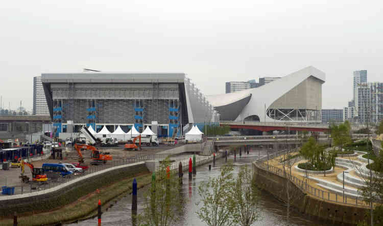 A picture shows a general view of the exterior of the Water Polo Arena (L) and the Aquatics center (R) at the Olympic Park in Stratford, east London, on May 2, 2012. AFP PHOTO / MIGUEL MEDINA