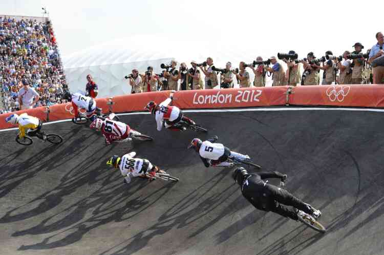 Riders take a corner during the BMX cycling men's final event at the London 2012 Olympic Games in the Olympic Park in east London on August 10, 2012.    AFP PHOTO / LEON NEAL
