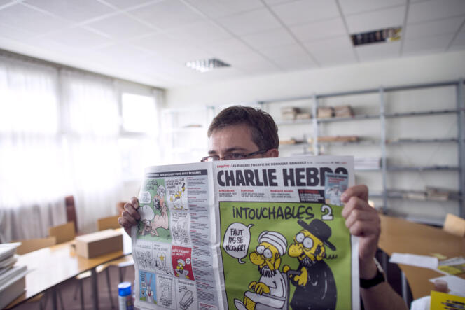 Le dessinateur Charb, dans les locaux de Charlie Hebdo, en septembre 2012. 