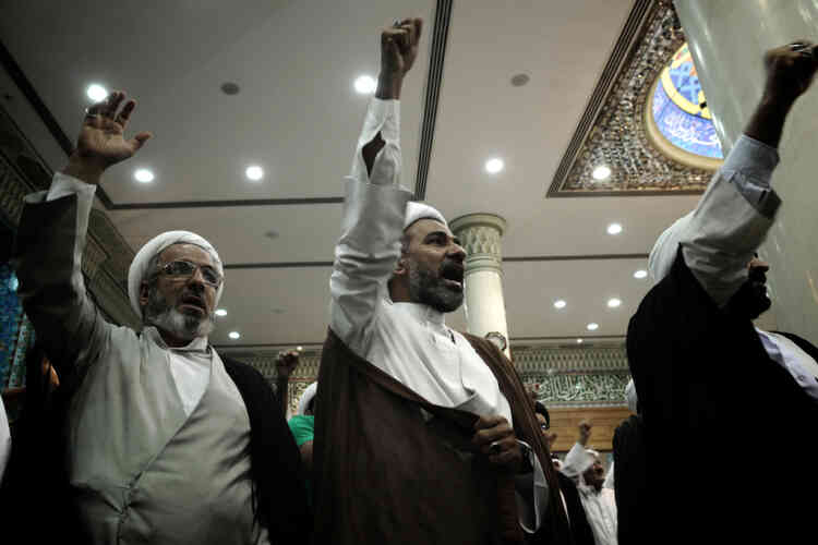 TOPSHOTS  Bahraini Shiite Muslim clergymen chant slogans during a gathering in Sanabis village, west of Manama on September 20, 2012 to protest against a film mocking Islam. Several nations across the Muslim world staged protests against the amateur American-made internet video called "Innocence of Muslims." AFP PHOTO/MOHAMMED AL-SHAIKH