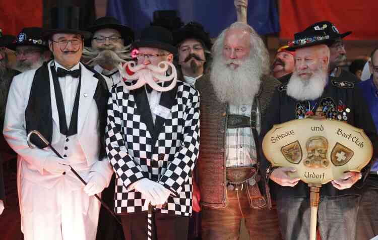 Participants take part in the 2012 European Beard and Moustache Championships in Wittersdorf near Mulhouse, Eastern France, September 22, 2012. More than a hundred participants competed in the first European Beard and Moustache Championships organized in France. REUTERS/Vincent Kessler (FRANCE - Tags: SOCIETY)