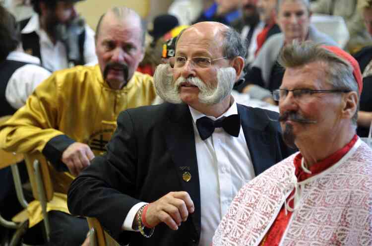 Competitors sit during the first edition of the European Beard and Moustache championships on September 22, 2012 in Wittersdorf, eastern France.  AFP PHOTO / SEBASTIEN BOZON