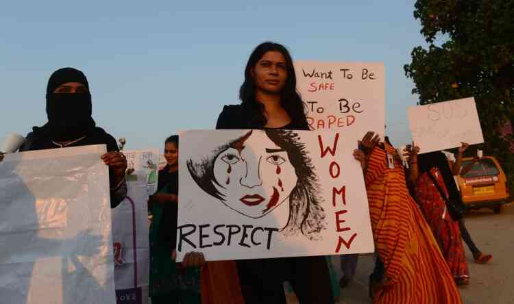 Indian members of NGO 'Aastha' hold placards as they march during a protest in Mumbai on December 27, 2012, for better safety for women following the rape of a student in the Indian capital. Protests across India over the last week against sex crimes have denounced the police and government, with the largest in New Delhi at the weekend prompting officers to cordon off areas around government buildings. One policeman was killed and more than 100 people injured in the violence.  AFP PHOTO/ PUNIT PARANJPE