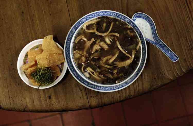 Snake meat is seen in a bowl of snake soup served at a snake soup shop in Hong Kong January 30, 2013. There are scores of people in Hong Kong who have through generations tamed snakes to make soup out of them, a traditional cuisine believed to be good for the health. Yet the people behind providing fresh snakes for the savoury meal thought to speed up the body's blood flow and keep it strong in the cold winter months may be doomed, with young people increasingly reluctant to take on a job they see as hard and dirty. Picture taken January 30, 2013. REUTERS/Bobby Yip (CHINA - Tags: ANIMALS SOCIETY FOOD)