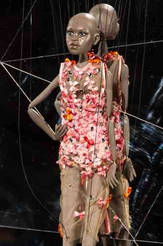 A marionette presents a creation by Fause Haten during the Sao Paulo Fashion Week 2013 Summer collections, in Sao Paulo, Brazil, on March 20, 2013. Real size collections are also showed after the show. AFP PHOTO / Yasuyoshi CHIBA