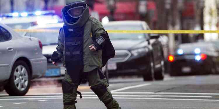 A law enforcement bomb technician walks away after preparing the controlled detonation of a suspicious object during a search for a suspect in the Boston Marathon bombing, in Watertown, Massachusetts April 19, 2013. Police killed one suspect in the Boston Marathon bombing during a shootout and were engaged in a house-to-house search for a second man on Friday in the Boston suburb of Watertown after a bloody night of shooting and explosions in the city's streets.      REUTERS/Lucas Jackson (UNITED STATES - Tags: SPORT ATHLETICS CIVIL UNREST CRIME LAW TPX IMAGES OF THE DAY)