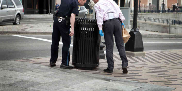 BOSTON, MA - APRIL 19: A Boston Police officer and detective search South Station for suspicious material after two bullets were found outside of the T stop on April 19, 2013 in Boston, Massachusetts. South Station was shut down and heavily guarded with police in response to the early morning shootings in Cambridge and Watertown, Massachusetts. After a car chase and shoot out with police, one suspect in the Boston Marathon bombing, Tamerlan Tsarnaev, 26, was shot and killed by police early morning April 19, and a manhunt is underway for his brother and second suspect, 19-year-old suspect Dzhokhar A. Tsarnaev. The two men, reportedly Chechen origin, are suspects in the bombings at the Boston Marathon on April 15, that killed three people and wounded at least 170.   Kayana Szymczak/Getty Images/AFP== FOR NEWSPAPERS, INTERNET, TELCOS & TELEVISION USE ONLY ==