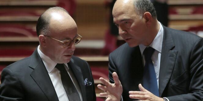 Bernard Cazeneuve, ministre du budget, et Pierre Moscovici, ministre de l'économie et des finances, au Sénat, le 19 septembre. 