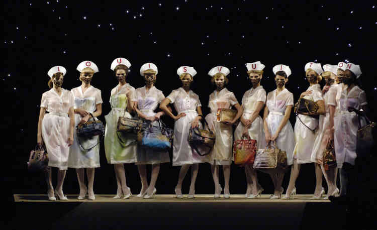 Models present creations  by U.S. designer Marc Jacobs for French fashion house Louis Vuitton as part of his Spring/Summer 2008 ready-to-wear fashion collection in Paris October 7, 2007.     REUTERS/Gonzalo Fuentes  (FRANCE) - RTR1UOVM