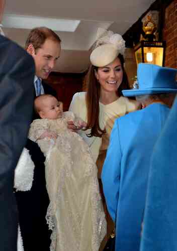 Britain's Queen Elizabeth II, right,  speaks with Prince William and Kate Duchess of Cambridge as they arrive with their son Prince George at the Chapel Royal in St James's Palace, Wednesday Oct. 23, 2013. Britain's 3-month-old future monarch, Prince George will be christened Wednesday with water from the River Jordan at a rare four-generation gathering of the royal family in London.  (AP Photo/John Stillwell/Pool)