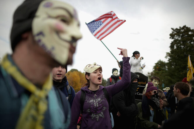 Des militants d'Anonymous, d'Occupy Wall Street et d'autres collectifs lors d'une manifestation à Washington. 