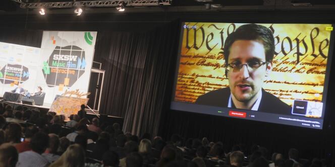 Sur l’écran géant, l’ex-consultant de l’Agence nationale de la sécurité américaine, Edward Snowden, s’exprime, depuis la Russie, au Festival high-tech d’Austin, lundi 10 mars.