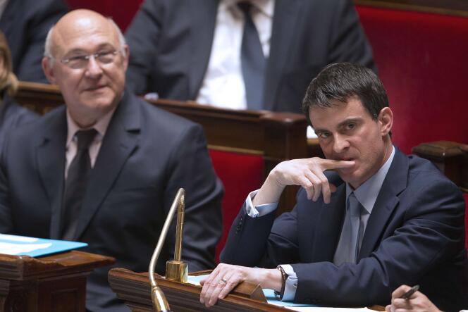 Manuel Valls et Michel Sapin, à l'Assemblée nationale le 13 mai 2014.