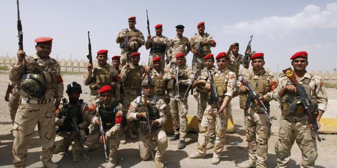 Des membres des forces de sécurité irakienne à Bagdad, le 13 juin.