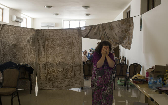 Une famille chrétienne ayant fui Mossoul s'est réfugiée dans le sous-sol d’une église d’Erbil. Ici, le 22 juillet.