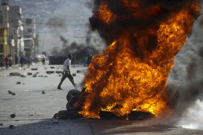 Lors d'une manifestation appelant à la démission du président haïtien, Michel Martelly, à Port-au-Prince, le 11 janvier.
