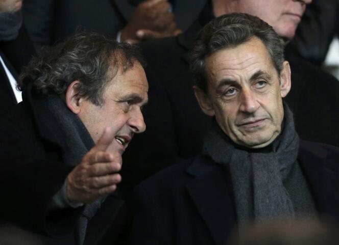 Le président de l'UEFA, Michel Platini, et Nicolas Sarkozy lors d'un match entre le PSG et Chelsea au Parc des Princes, à Paris, le 17 février.