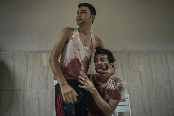 Le 23 juillet 2014 à Khan Younès, dans la bande de Gaza, pendant l'opération Bordure protectrice. Cette photographie a été récompensée par le World Press Photo 2015, dans la catégorie General News.