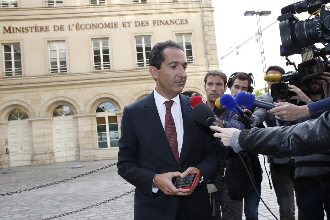 Patrick Drahi, en visite au ministère de l'économie le 23 juin. Le tycoon des médias n’a pas voulu commenter la décision de Martin Bouygues.