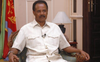 Eritrea's President Isaias Afwerki listens to a question during an interview with Reuters in the capital Asmara May 20, 2009. President Afwerki believes the financial crisis is a welcome restructuring of the global economic order and vindication of Eritrea's much-vaunted principles of self-reliance and sustainability. Picture taken May 20, 2009. REUTERS/Presidential Press Service/Handout (ERITREA POLITICS) FOR EDITORIAL USE ONLY. NOT FOR SALE FOR MARKETING OR ADVERTISING CAMPAIGNS - RTXKO8N