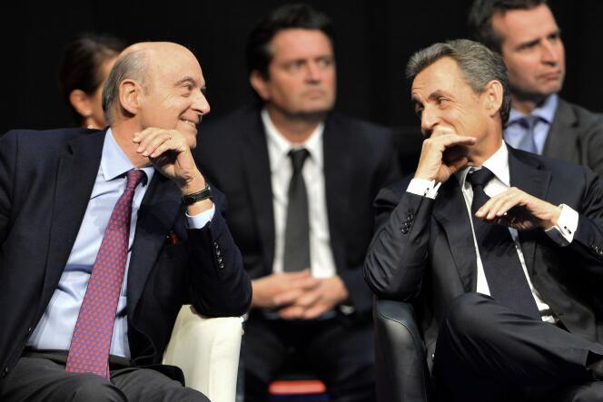 Alain Juppé et Nicolas Sarkozy lors d’un meeting à Limoges, le 14 octobre 2015.