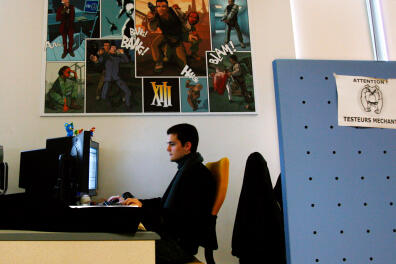 A Ubisoft employer works, 14 December 2007 at French video games Ubisoft company headquarters in Montreuil-sous-Bois, outside Paris. Shares in Ubisoft Entertainment rose sharply today after the video games maker improved its full-year sales and operating profit guidance because of very strong sales for its Assassin's Creed game. AFP PHOTO BERTRAND GUAY