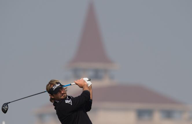 Victor Dubuisson of France, wearing black to commemorate the victims of the Paris attacks, tees off during the BMW Shanghai Masters golf tournament at the Lake Malaren Golf Club in Shanghai on November 14, 2015. AFP PHOTO / JOHANNES EISELE
