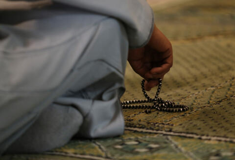 A Muslim worshipper holds prayer beads before attending the Friday prayer service at Madrid’s main mosque, Friday, Nov. 20, 2015 During the ceremony, the imam criticised the attacks last week in Paris, calling the perpetrators corrupted of the faith and saying that on killing innocent people they had attacked all humanity. (AP Photo/Francisco Seco)
