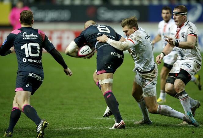 Players from Stade Français play against those from Stade Toulouse for the Top 14, in January 2016, in Paris.