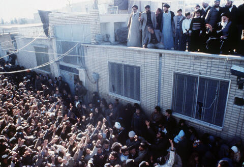 FILE - In this undated 1979 file photo, Iran's new leader, Ayatollah Khomeini waves at the crowd at Qom, Iran. After the overthrow of the shah and takeover of the U.S. Embassy in Tehran, Saudi Arabia quickly became America's top ally in the region.(AP Photo, File)