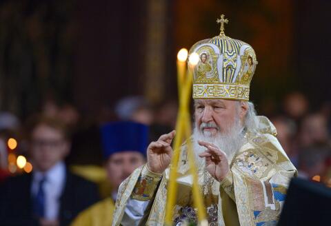 Russian Patriarch Kirill celebrates a Christmas service in Christ the Savior cathedral in Moscow early on January 7, 2016. Orthodox Christians celebrate Christmas on January 7 in the Middle East, Russia and other Orthodox churches that use the old Julian calendar instead of the 17th-century Gregorian calendar adopted by Catholics, Protestants, Greek Orthodox and commonly used in secular life around the world. / AFP / NATALIA KOLESNIKOVA