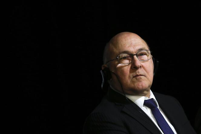 French Finance Minister Michel Sapin arrives for the presentation of his and German Finance Minister Wolfgang Schaeuble's book 'Anders Gemeinsam' , Different Together, at the French embassy in Berlin, Germany, Monday, March 21, 2016. The book is written in collaboration with the journalists Ulrich Wickert and Dominique Seux. (AP Photo/Markus Schreiber)