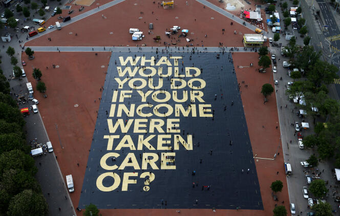 Pancarte à Genève, le 14 mai 2016 : « Que feriez-vous si votre salaire était assuré ? »