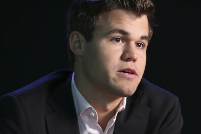 World chess champion Magnus Carlsen, of Norway, talks to reporters after a news conference to promote the World Chess Championship in New York, Thursday, Nov. 10, 2016. Carlsen will play Sergey Karjakin, of Russia, starting Nov. 11, 2016, in New York. (AP Photo/Seth Wenig)