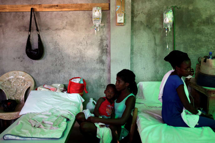 A woman takes care of her son, who is receiving treatment for cholera, at the Immaculate Conception Hospital in Les Cayes, Haiti, November 8, 2016. REUTERS/Andres Martinez Casares