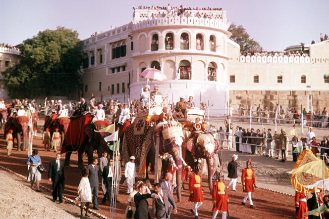 During the royal tour of India in 1961, Queen Elizabeth II on an elephant in the city of Varanasi.