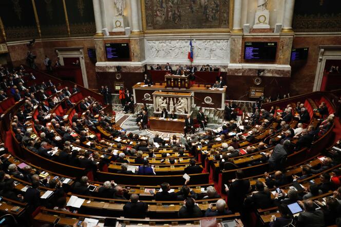 Members of Parliament attend a session of questions to the government, on February 22, 2017 at the French national Assembly, in Paris. 