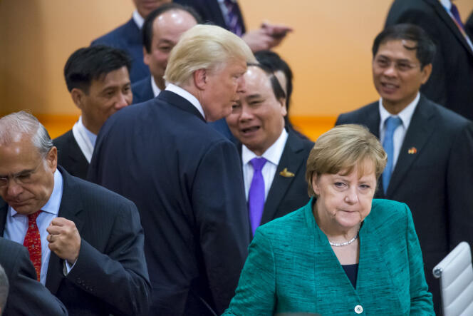 Le président américain, le premier ministre vietnamien et la chancelière allemande durant le sommet du G20, à Hambourg (Allemagne), le 8 juillet.