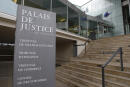 The entrance of the hall of justice is pictured Tuesday, Feb.13, 2018 in Pontoise, outside Paris. A 29-year-old man is set to appear in a French court Tuesday for having sex with an 11-year-old girl last year, in a trial that has rekindled debate on the age of sexual consent in France. In a decision that shocked many, the prosecutor's office in the Paris suburb of Pontoise decided to send the man to trial on charges of "sexual abuse of a minor under 15 years old," and not rape. (AP Photo/Francois Mori)